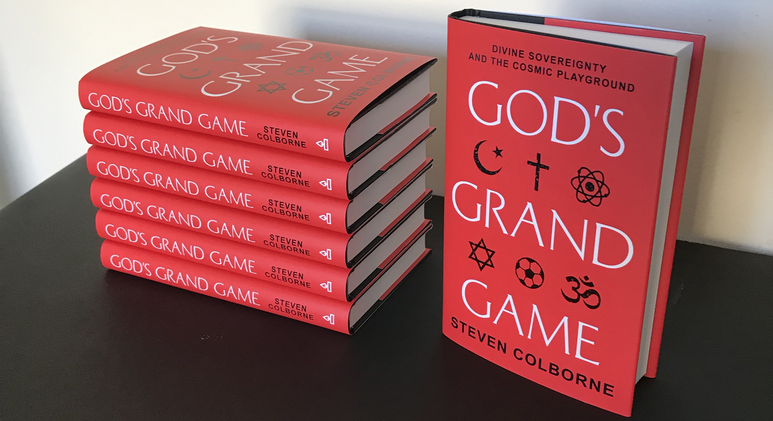 Hardback copies of God's Grand Game by Steven Colborne